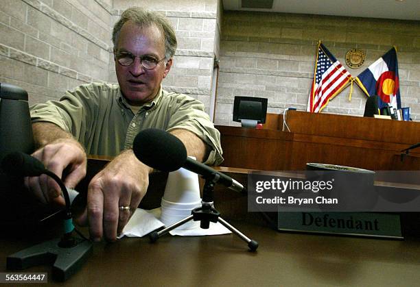 Court TV camera operator Dennis Lynch sets up microphones, on Tuesday, at the table where Laker star Kobe Bryant will hear the sexual assault case...