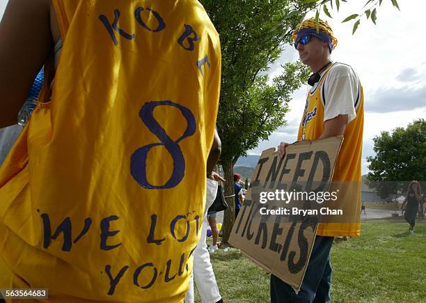 Ethan Sahker, right, of Denver, holds a sign supporting Los Angeles Lakers star Kobe Bryant outside Eagle County Justice Center. Bryant made his...