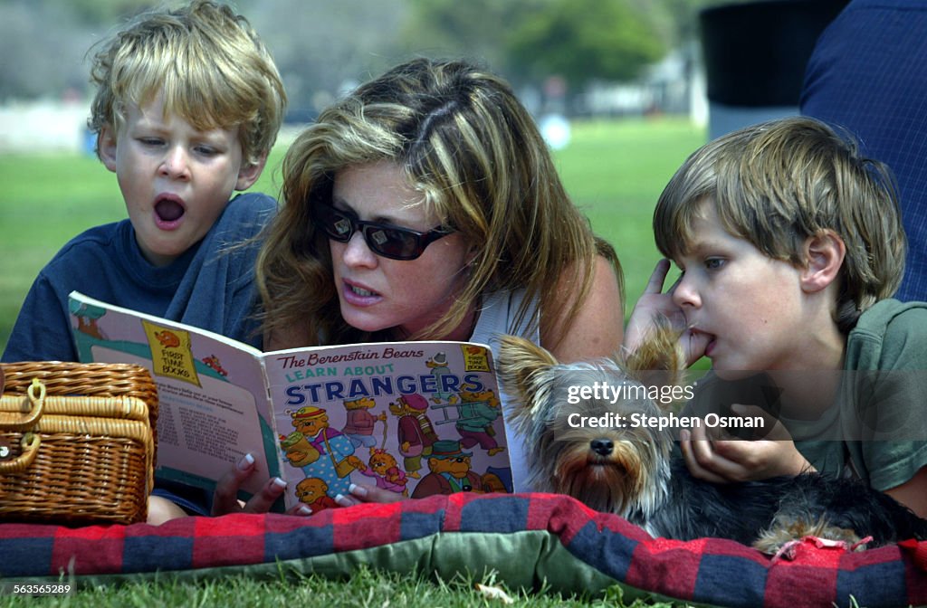 Lori Carhart of Agoura reads a book called "Learn about Strangers" from the The Berenstain Bears ser