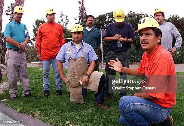 Pictsweet workers use their break talk about new legislation that will help end disputes between farm workers and their employers. Jesus Torres 42,...