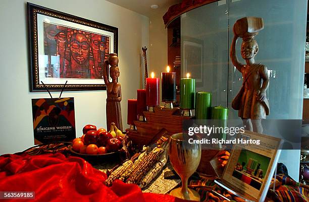 Dawn Sutherland celebrates Kwanzaa with friends at her home, Sunday afternoon in Baldwin Hills. Her home is filled with African art and African...