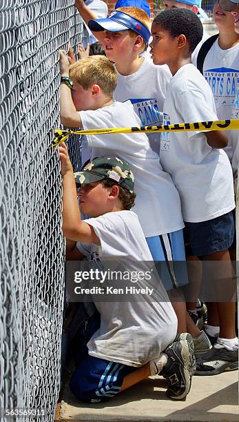 Dedication of the Rosalind "Roz" Wyman Diamond at Cheviot Hills Recreation Center. July 21, 2003. Photo of kids from Cheviot Hills sports camp peer...