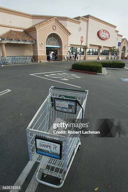 At the Ralphs market on Warner Ave. In Huntington Beach the parking lot is almost empty with few shoppers crossing the picket line with the strike in...