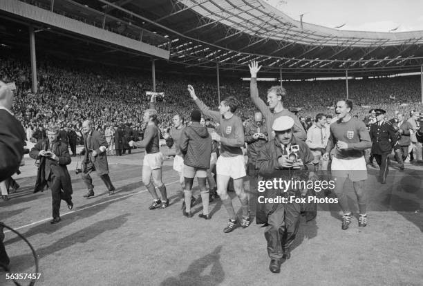 From left to right, Bobby Moore, Alan Ball, George Cohen, Jack Charlton and Martin Peters do a lap of honour at Wembley after beating West Germany...
