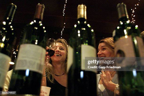 Wine tasting is held at Wine House on 1/18/2002 where wine tasters tasted Cabernet wines. Natalie Bell and Lesley Vicari partake in the Cabernet...