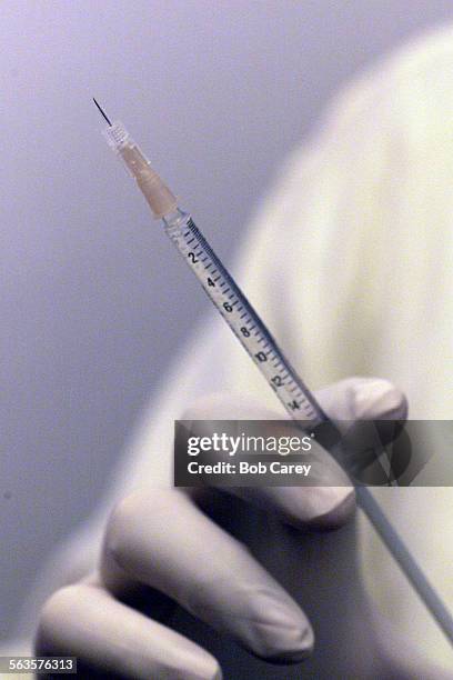 Dr. Stuart Kaplan holds a hyperdermic needle with botox in his Beverly Hills office.