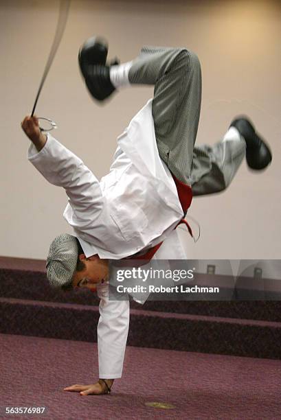 Ringling Bros. And Barnum & Bailey' s clown David Larible does a handstand during his presentation to doctors and nurses at CHOC about ways to bring...