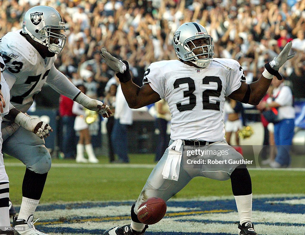 Oakland Raiders running back Zack Crockett celebrates after scoring a touchdown on a short run in th