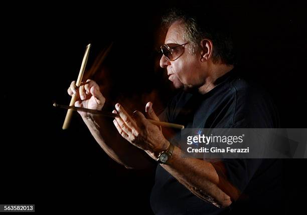 Hal Blaine one of the most famous drummers in the history of pop music, plays with his sticks in his home in Palm Desert.