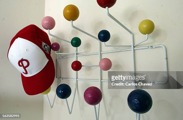 Richard and Kathryn Waltzer of Pacific Palisades have a Ray and Charles Eames designed "Hang it All", for their hats by their front door.