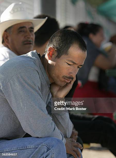 The look of despair registers on the face of those who are not hired for work at the Macehualli Work Center in Phoenix, Arizina. Proposition 200 is...