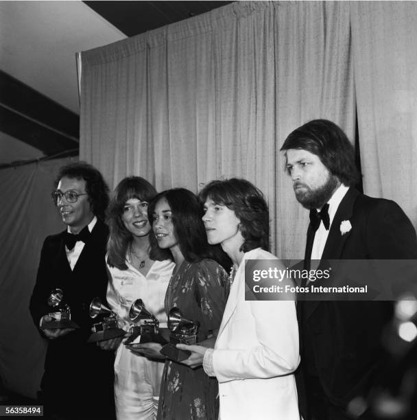 Bill Danoff, his wife, Taffy Nivert Danoff, Margot Chapman, and Jon Carroll of the American rock group the Starland Vocal Band pose with their Grammy...