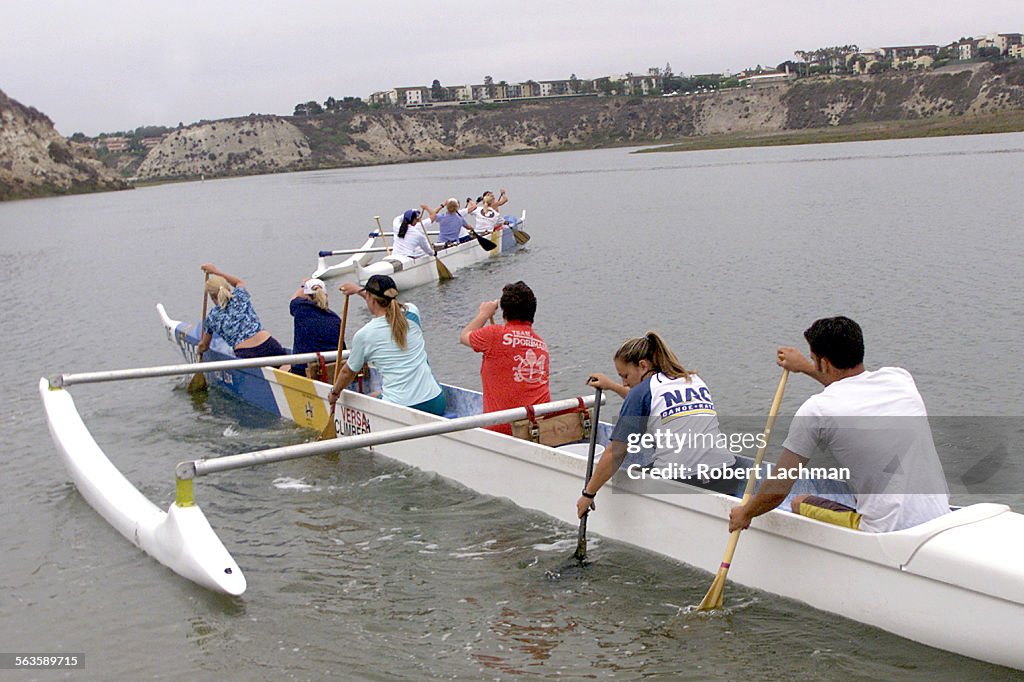 (Newport Beach, CA) Members of the Newport Aquatic Center woman's outrigger canoe team, along with c