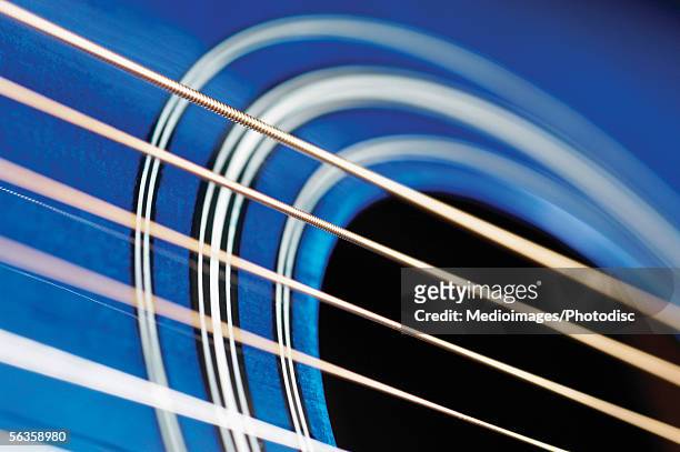 extreme close-up of guitar strings - musical instrument string stock pictures, royalty-free photos & images
