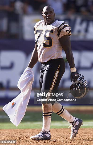 San Diego Chargers defensive end Marcellus Wiley heads to the sidelines near the end of the game against the New England Patriots at Qualcomm Stadium...