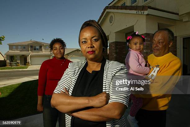 Debbie Carter with members of her family at their Lancaster home. Debbie is with her fatherinlaw Markus Carter, daughter Alicia Carter, and...