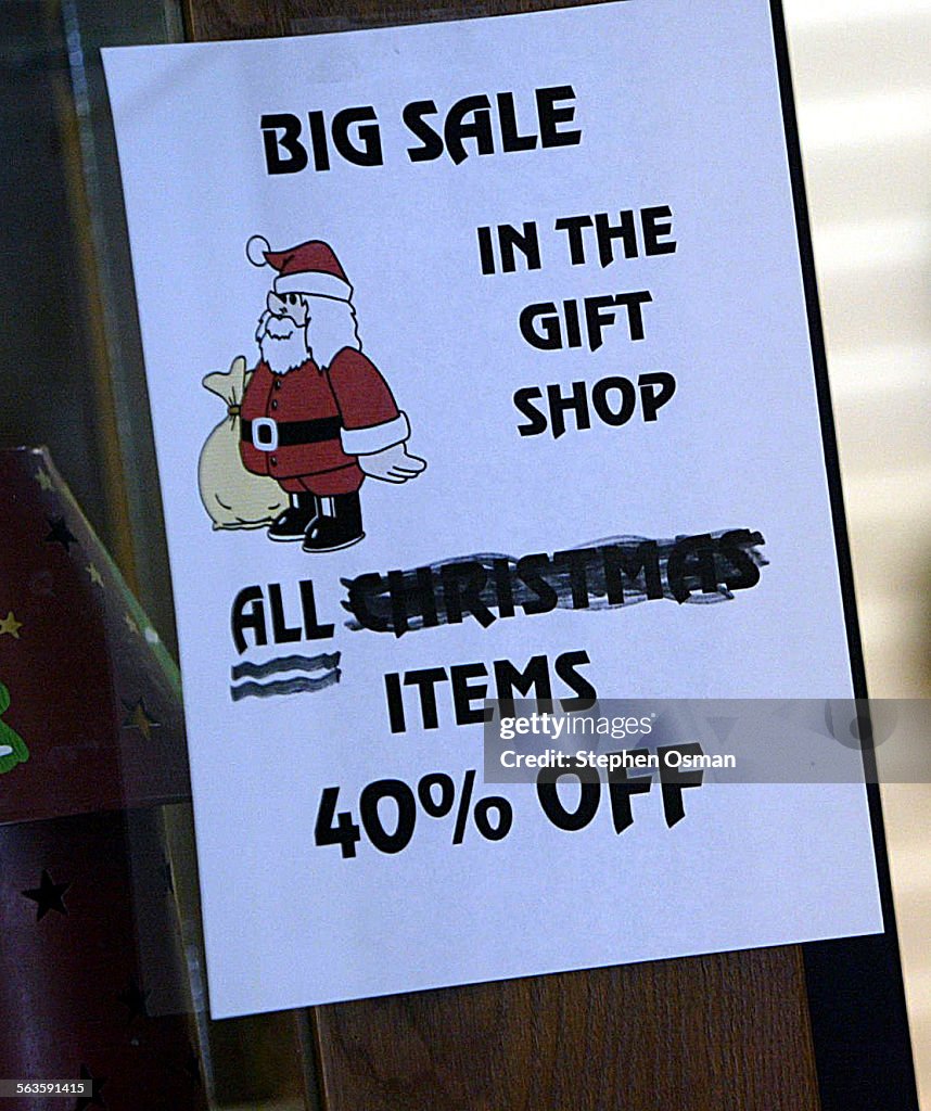 A sign posted outside the gift shop shows 40% percent off all items. The maternity ward at Santa Pau