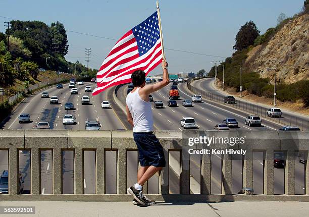 In response to September 11, 2001 terrorists attacks, Luc Jon Dorado of Big Bear Lake started waving the American flag on top of the Mulholland...
