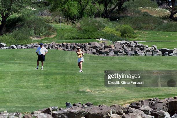 Jim and Janet Gallagher of Camarillo braves the 100 degree temperatures to play the TPC Stadium Course at La Quinta Resort. Green fees are...