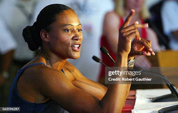 Marion Jones talks with the media after officially pulling out of the Women's 200 meter competition at the U.S. Olympic Track and Field Team Trials...