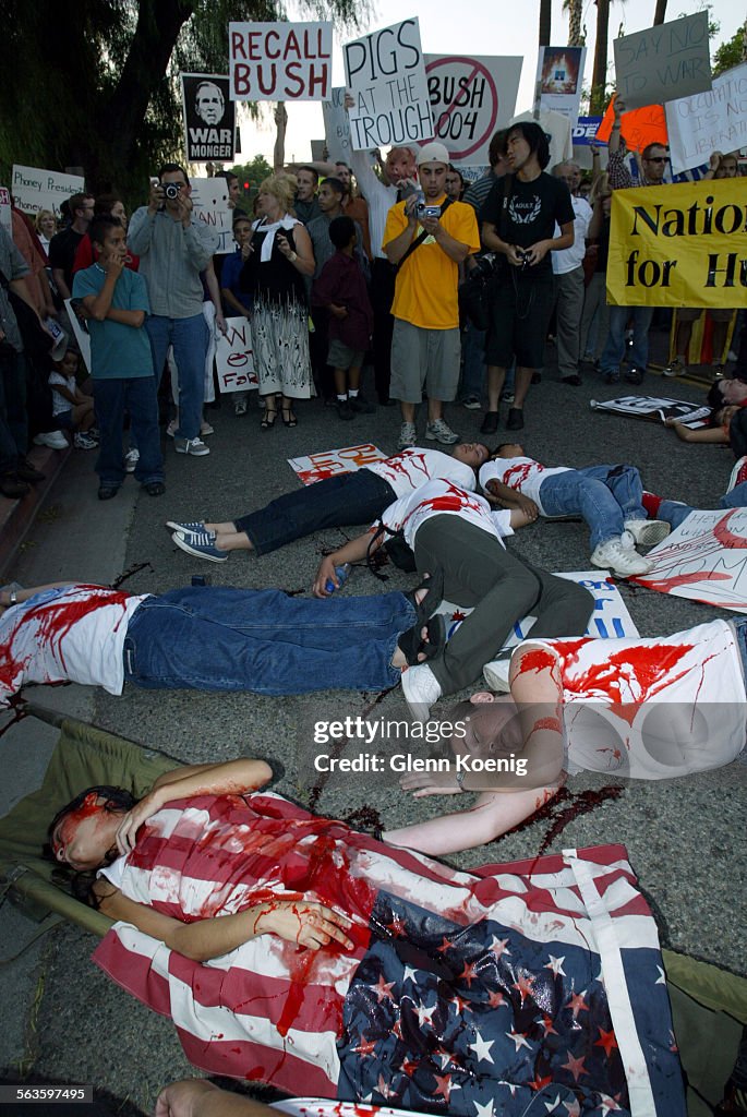 protestors-wearing-fake-blood-perform-a-die-in-to-simulate-death-news-photo-getty-images