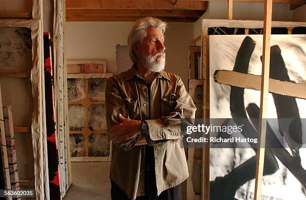 Artist Ed Moses in the storage racks of his studio, Thursday afternoon in Venice. The painter works with canvasses on the ground, a bit like Pollock