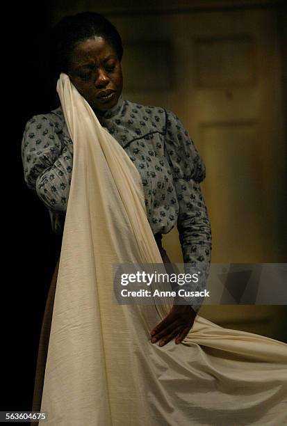 Viola Davis who plays Esther and is a seamstress holds a fine cloth to her face given to her by Mr. Marks.The play "Intimate Apparel" will be at the...