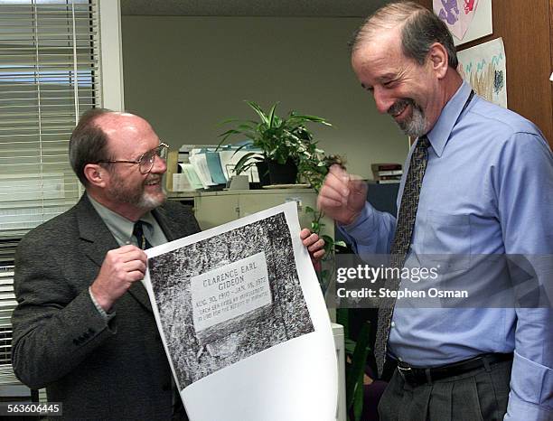 Ventura County Public Defender Ken Clayman, right, reacts after Chief Deputy Public Defender Mike McMahon shows off a poster of Clarence Earl...