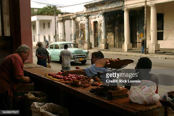 Havana, CubaCubans purchase produce from a sidewalk stand stand in Havana, where food is often a scarce commodity. Photo/Art: ^^^ / Los Angeles...