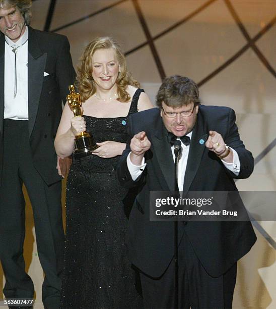 Film director Michael Moore makes an antiwar statement as he accepts his Oscar for Documentary Feature for "Bowling for Columbine" at the 75th...