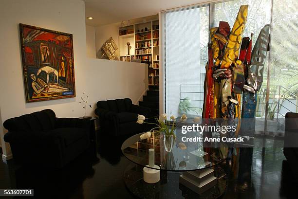 In the living room is a sculpture Cafe Macedonia by John Chamberlain and on the wall at left is City of Gypsies by Mimmo Paladino. Mandy and Cliff...