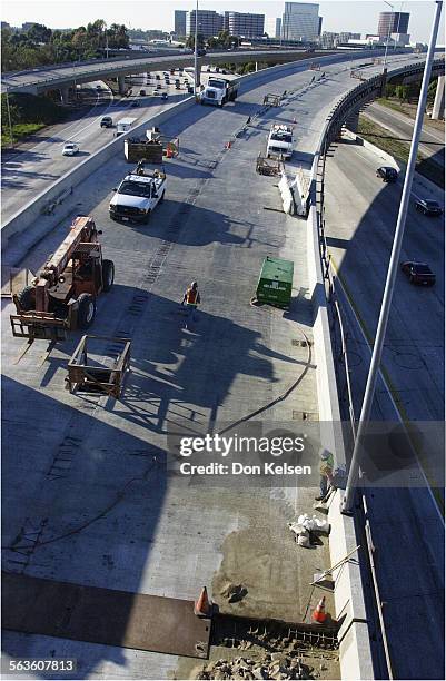 The Carpool flyover from the North 405 to North 55, looking West at South Coast Metro skyline in Costa Mesa. Continuing construction to repair the...