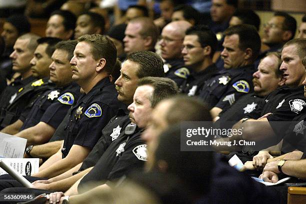 Nearly 450 officers from 26 different agencies gather for a briefing Monday morning before heading out for a parole, probation and gang compliance...
