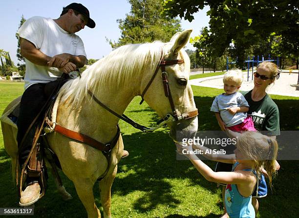 Howard Reinstein, 45 years old of Lake Balboa area, is aboard his Quarterhorse Ginger as he rides to the top of Porter Ridge Park in Porter Ranch....