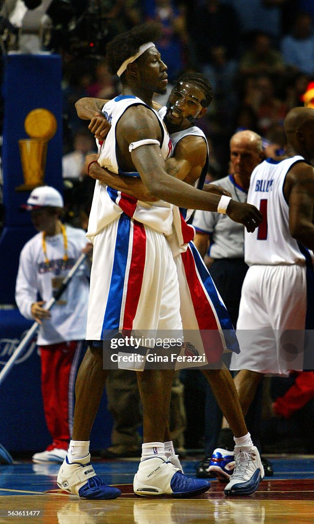 Piston Richard Hamilton hugs Ben Wallace as the Pistons win Game 4 of the NBA Finals at The Palace i