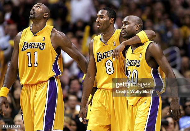 Lakers Karl Malone, Kobe Bryant and Gary Payton walk off the court as the Lakers defeated the Timberwolves in Game 4 of the Western Conference Finals...