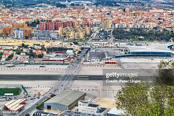 gibraltar airport that crosses a four-lane road - gibraltar stock pictures, royalty-free photos & images