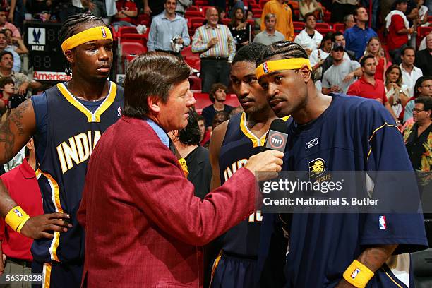 Reporter Craig Sager interviews Stephen Jackson of the Indiana Pacers with Ron Artest and Jermaine O'Neal after the game against the Miami Heat at...