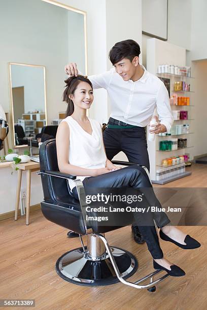 hairdresser working on customer - fashion woman floor cross legged stock pictures, royalty-free photos & images