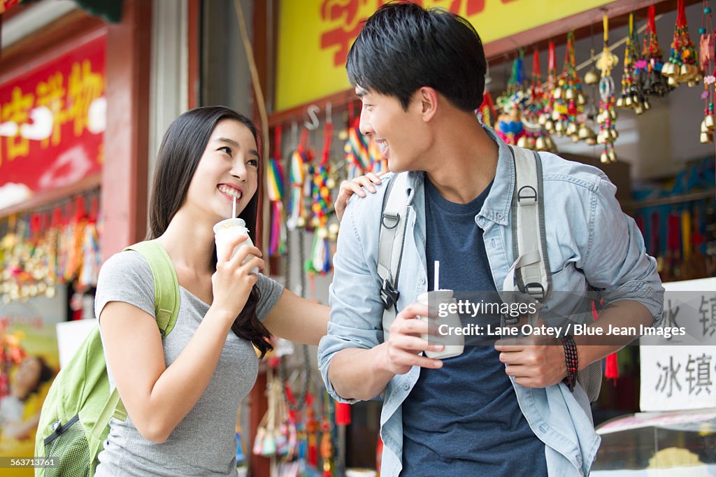 Young couple drinking yogurt