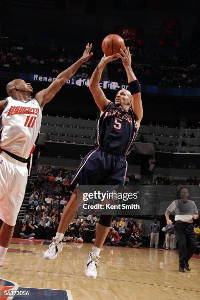 Jason Kidd of the New Jersey Nets attempts a jump shot over Kevin Bogans of the Charlotte Bobcats on December 7, 2005 at the Charlotte Bobcats Arena...