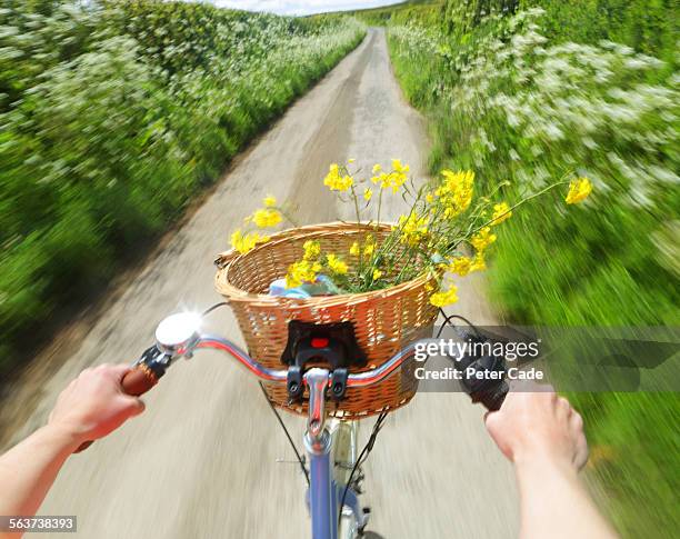 riding a bike through lane , just hands visible - bicycle basket stock pictures, royalty-free photos & images