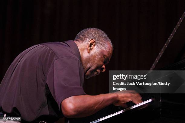 American free jazz musician and composer Muhal Richard Abrams plays piano as he performs during a World Music Institute concert at Alice Tully Hall,...