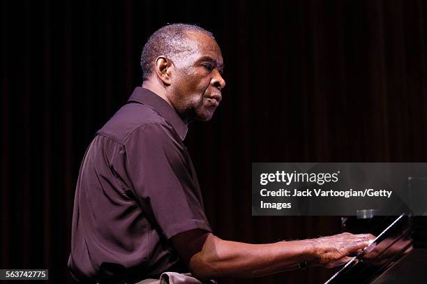 American free jazz musician and composer Muhal Richard Abrams plays piano as he performs during a World Music Institute concert at Alice Tully Hall,...