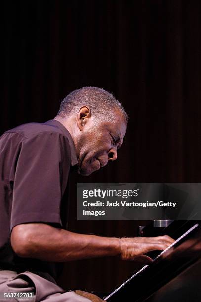 American free jazz musician and composer Muhal Richard Abrams plays piano as he performs during a World Music Institute concert at Alice Tully Hall,...