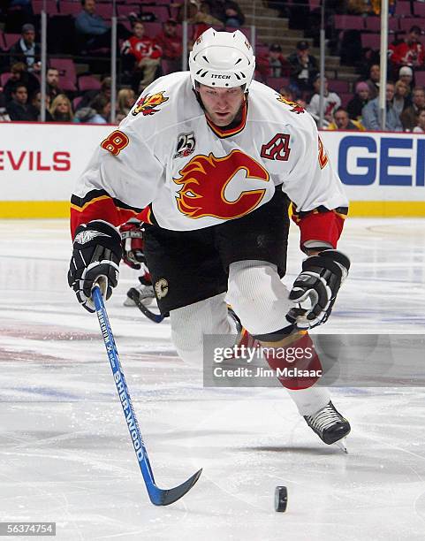 Defenseman Robyn Regehr of the Calgary Flames skates after the puck against the New Jersey Devils during their game on December 7, 2005 at...