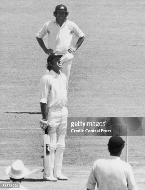 Kent and England cricketer Brian Luckhurst grimaces in pain after being hit again on his injured hand by Thomson, during the 2nd Test against...
