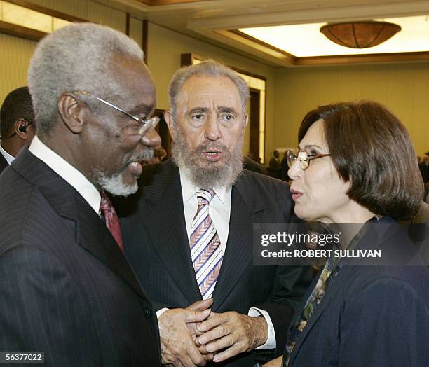 President Fidel Castro of Cuba speaks with Jamaica's Prime Minister P.J. Patterson through an unidentified inturpiter 08 December 2005, at the...