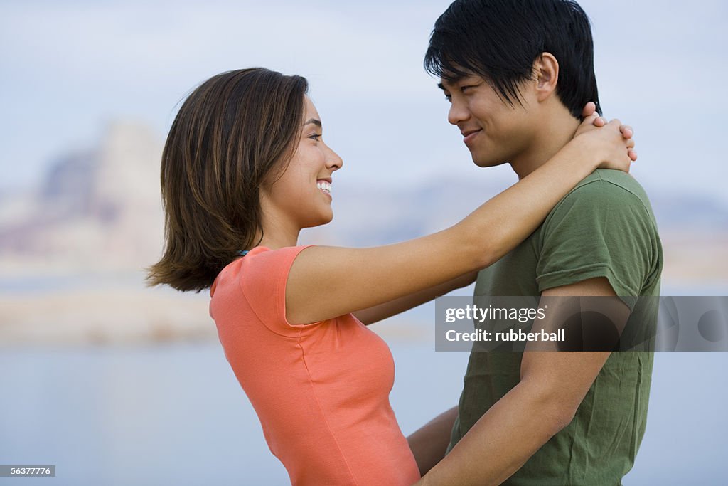 Profile of a young couple looking at each other