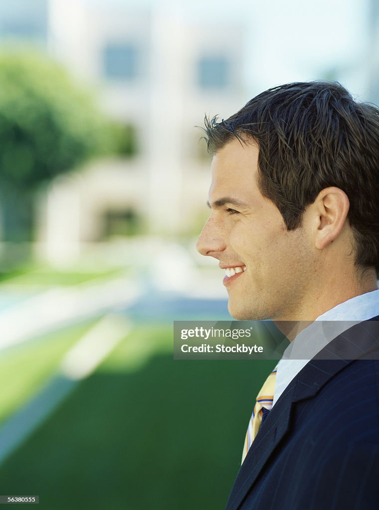 Side profile of a businessman smiling